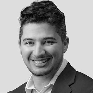 Youssef Sanhadji Protrait image of event speaker Youssef Sanhadji in black and white. You see his head and the top of his shoulders as well as his smiling face